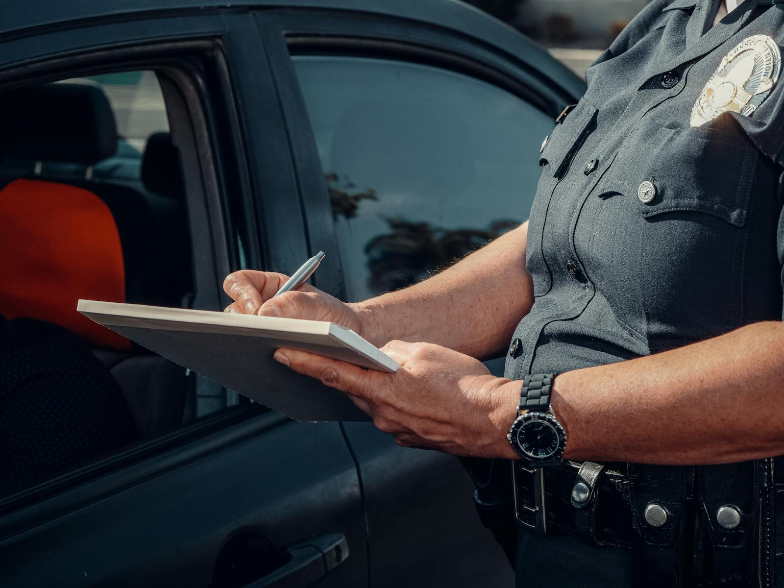 Police Officer Writing on a Notebook, sr22